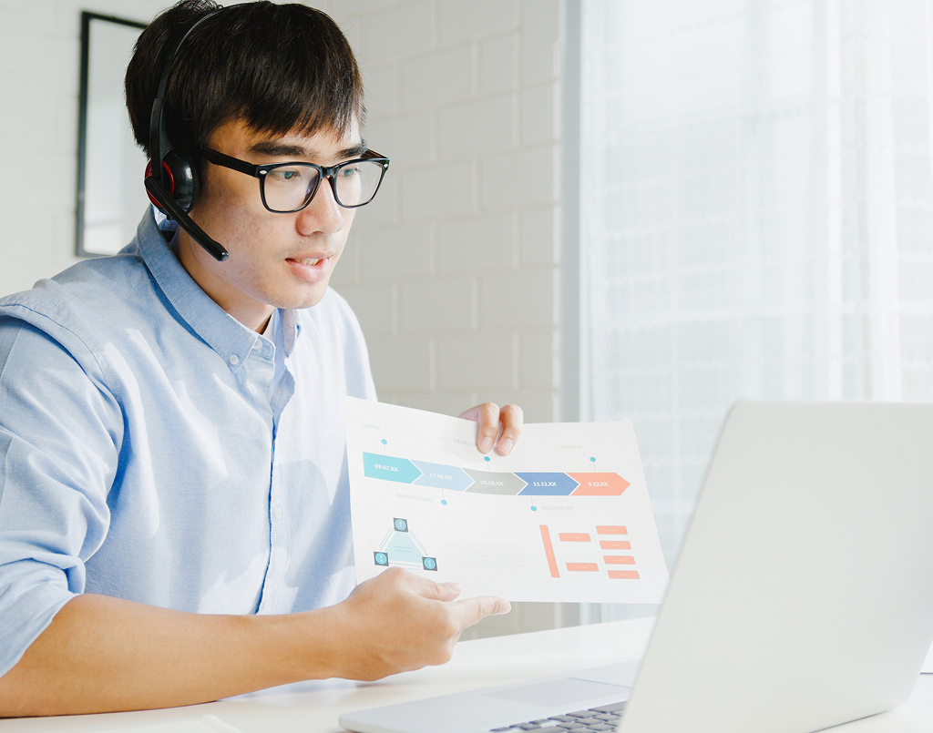Young Asian businessman using a laptop — offshore professional in the Philippines
